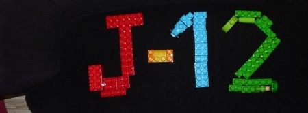 J - 12