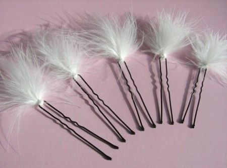 pic à cheveux plumes