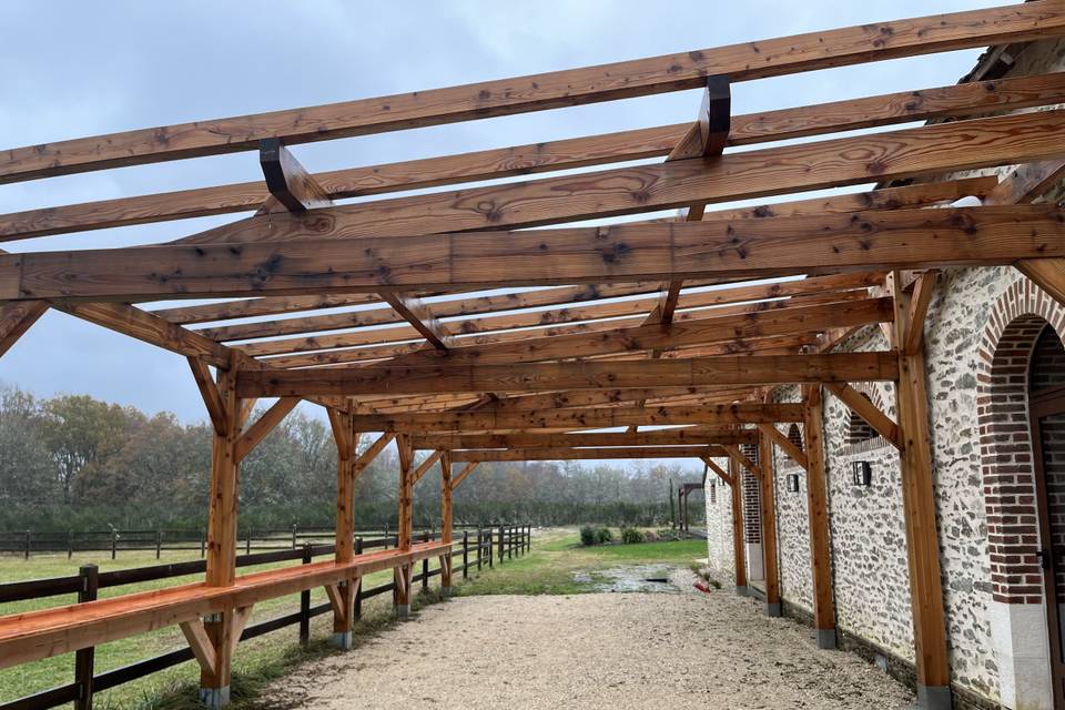 La terrasse sous pergola