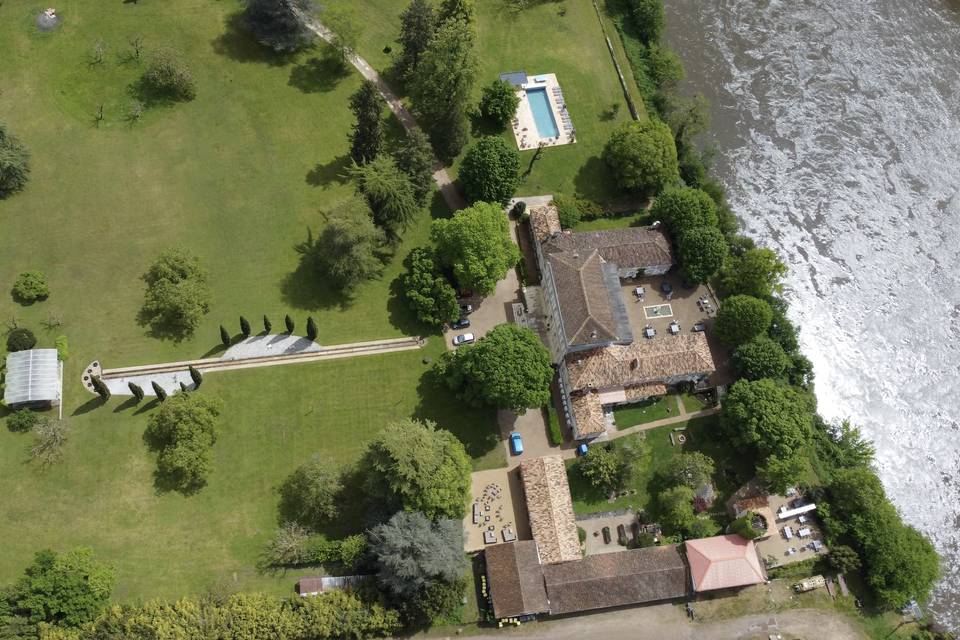Directly on the river